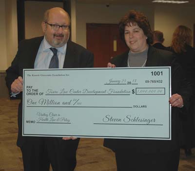 Touro Law Board of Governors member and head of the Kermit Gitenstein Foundation Steven Schlesinger  presents a $1 million check to Dean Patricia Salkin.