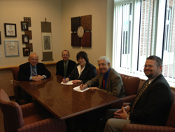 (l to r) Touro Law alum Bruce K. Gould '84, Touro Law Assistant Dean for Admissions George Justice, Touro Law Dean Patricia Salkin, Dean of UCF’s College of Health & Public Affairs Michael Frumkin, and UCF Legal Studies Chair James Beckman sign the 3+3 program agreement between Touro Law Center and UCF.