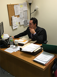 Larry Pisahov at desk